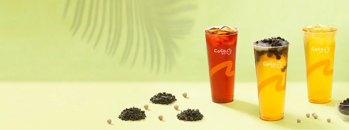Fresh black tea, jasmine tea, and bubble gaga CoCo bubble teas, with fresh green background.